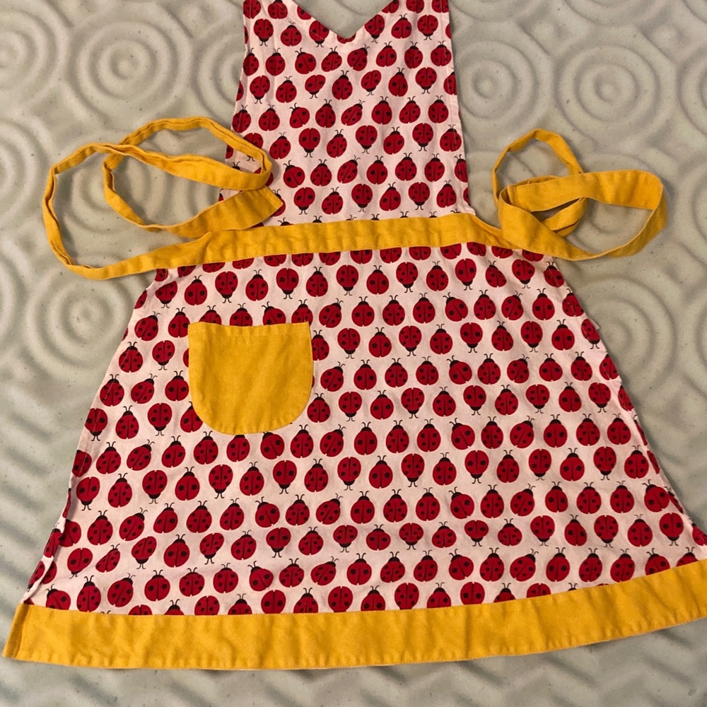 Ladies Ladybug Apron with Yellow Trim and Pocket.